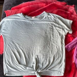 A light blue, short sleeve shirt